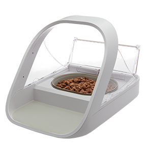 A cat eating from a SureFeed Microchip Pet Feeder